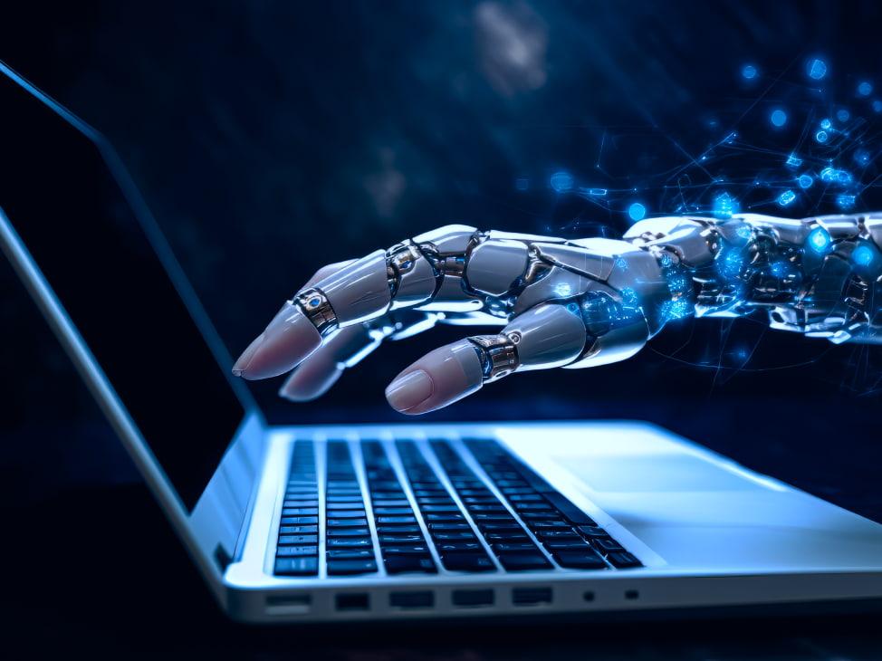 Robotic hand typing on laptop