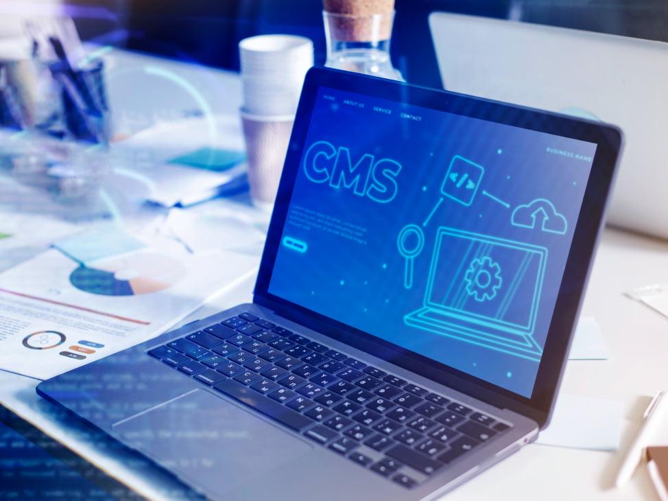 laptop with cms on the screen